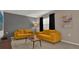 Cozy living room featuring comfortable sofas, neutral walls, and a carpeted floor at 4571 Cabello Loop, Kissimmee, FL 34746