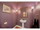 Elegant powder room with pedestal sink at 9664 Weatherstone Ct, Windermere, FL 34786