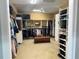 Large walk-in Primary closet with ample shelving and hanging space at 9664 Weatherstone Ct, Windermere, FL 34786