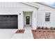 Charming entrance with a black front door at 12220 Sw 76Th Ln, Dunnellon, FL 34432