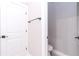 Bright half bathroom with white door, modern black hardware, and neutral paint color at 12386 Sw 89Th St, Dunnellon, FL 34432