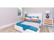 Serene bedroom with a white bed frame, blue bedding, and matching nightstands with lamps at 12386 Sw 89Th St, Dunnellon, FL 34432