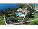 Stunning aerial view of a community pool, mini golf course, clubhouse, and lake with lush green landscape at 15531 Waterleigh Cove Dr, Winter Garden, FL 34787