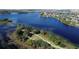Expansive aerial view of a community by a lake, highlighting the waterfront lifestyle at 15531 Waterleigh Cove Dr, Winter Garden, FL 34787
