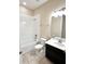 Bathroom showcasing a bathtub, shower combo and vanity, providing a functional space at 15531 Waterleigh Cove Dr, Winter Garden, FL 34787