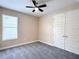 Cozy bedroom with a ceiling fan, a window, and a spacious closet at 15531 Waterleigh Cove Dr, Winter Garden, FL 34787