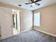 Bedroom featuring neutral walls, carpet, a window, and closet space at 15531 Waterleigh Cove Dr, Winter Garden, FL 34787