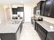 A beautifully appointed kitchen with granite countertops and stainless steel appliances at 15531 Waterleigh Cove Dr, Winter Garden, FL 34787