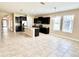 Spacious open concept kitchen with a central island, granite countertops, and ample natural light at 15531 Waterleigh Cove Dr, Winter Garden, FL 34787