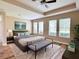 Relaxing main bedroom with a trey ceiling, a king bed, lots of windows and natural light at 15531 Waterleigh Cove Dr, Winter Garden, FL 34787