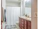 Bathroom with double vanity and shower at 22711 State Road 44, Eustis, FL 32736