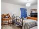 Bedroom with a double bed and wood floors at 22711 State Road 44, Eustis, FL 32736