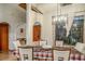 Spacious dining room with large windows and chandelier at 22711 State Road 44, Eustis, FL 32736