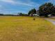 Long private driveway leading to the property at 22711 State Road 44, Eustis, FL 32736