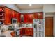 Kitchen with wood cabinets and stainless steel appliances at 22711 State Road 44, Eustis, FL 32736