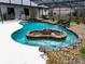 Inviting freeform pool with stonework and fire pit at 22711 State Road 44, Eustis, FL 32736