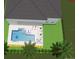 Aerial view of backyard pool with sun loungers, outdoor seating, and lush landscaping at 3867 Grassland Loop, Lake Mary, FL 32746
