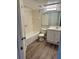 Clean bathroom featuring updated vanity, new mirror, and tiled shower and tub at 485 Forestway Cir # 202, Altamonte Springs, FL 32701