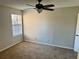 Bright bedroom with a ceiling fan and large window at 485 Forestway Cir # 202, Altamonte Springs, FL 32701