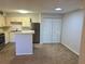 Modern kitchen with stainless steel appliances, light cabinets, and breakfast bar at 485 Forestway Cir # 202, Altamonte Springs, FL 32701
