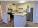 Well-equipped kitchen featuring stainless steel appliances and a functional breakfast bar at 485 Forestway Cir # 202, Altamonte Springs, FL 32701