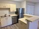 Clean kitchen with stainless appliances, lots of cabinets, and an eat-in counter at 485 Forestway Cir # 202, Altamonte Springs, FL 32701