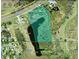 An aerial view shows the property lines near highway 60 and a pond area at 6301 State Road 60 E, Bartow, FL 33830