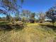 Vacant lot with mature trees and lush vegetation at 6301 State Road 60 E, Bartow, FL 33830