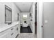 Modern bathroom with a freestanding tub, black hardware, and a sleek vanity at 8827 Sw 137Th Ct, Dunnellon, FL 34432