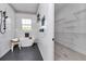 Bathroom featuring a soaking tub, shower, and walk-in closet with custom shelving at 8827 Sw 137Th Ct, Dunnellon, FL 34432