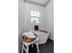 Bright bathroom featuring a soaking tub with a window view and stylish matte black fixtures at 8827 Sw 137Th Ct, Dunnellon, FL 34432