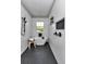 Bright bathroom featuring a soaking tub with a window view and stylish matte black fixtures at 8827 Sw 137Th Ct, Dunnellon, FL 34432