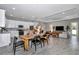 Open-concept dining room and kitchen showcasing modern cabinetry and stylish decor at 8827 Sw 137Th Ct, Dunnellon, FL 34432