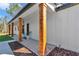 Charming front porch with natural wood pillars and the house number displayed at 8827 Sw 137Th Ct, Dunnellon, FL 34432