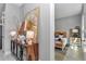 Hallway with a modern cabinet and decor leading to a bedroom with a woven headboard at 8827 Sw 137Th Ct, Dunnellon, FL 34432
