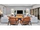 This living room features modern decor, comfortable seating, and natural light from the windows at 8827 Sw 137Th Ct, Dunnellon, FL 34432