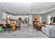 Open-concept living area with modern decor, connected to a well-equipped kitchen and dining space at 8827 Sw 137Th Ct, Dunnellon, FL 34432