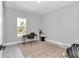Clean office space with natural light, desk, and chair on a rug, offering a bright and airy atmosphere at 8827 Sw 137Th Ct, Dunnellon, FL 34432
