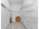 Walk-in closet offering ample storage space with bright white custom shelving at 8827 Sw 137Th Ct, Dunnellon, FL 34432