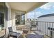 Relaxing balcony space features two chairs and a table, perfect for enjoying outdoor views at 953 Splash Shot Pl # 953, Davenport, FL 33896