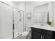 Bathroom featuring a glass-enclosed shower and a vanity with modern fixtures at 953 Splash Shot Pl # 953, Davenport, FL 33896