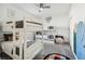 bedroom features two bunk beds, ceiling fan, and a playful decor at 953 Splash Shot Pl # 953, Davenport, FL 33896