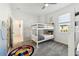 bedroom featuring a bunk bed with grey carpet and a ceiling fan at 953 Splash Shot Pl # 953, Davenport, FL 33896