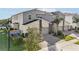Contemporary townhome exterior showcasing paved driveway, modern design, and 'Splash Shot Place' signage at 953 Splash Shot Pl # 953, Davenport, FL 33896