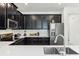 Close up view of a kitchen with stainless steel appliances and subway tile backsplash at 953 Splash Shot Pl # 953, Davenport, FL 33896