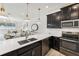 Open kitchen with stainless appliances and a view to dining and living areas at 953 Splash Shot Pl # 953, Davenport, FL 33896