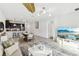 Stylish living space with modern lighting, open floor plan, and kitchen with breakfast bar at 953 Splash Shot Pl # 953, Davenport, FL 33896