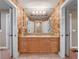 Bathroom featuring double sinks with granite countertops and stylish lighting at 100 Blue Lake Ct, Longwood, FL 32779