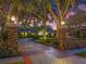 Brick pillars and iron gates accent the long driveway leading to this estate home at 100 Blue Lake Ct, Longwood, FL 32779