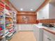 Well-organized laundry room with ample storage, countertop space, and modern appliances at 100 Blue Lake Ct, Longwood, FL 32779